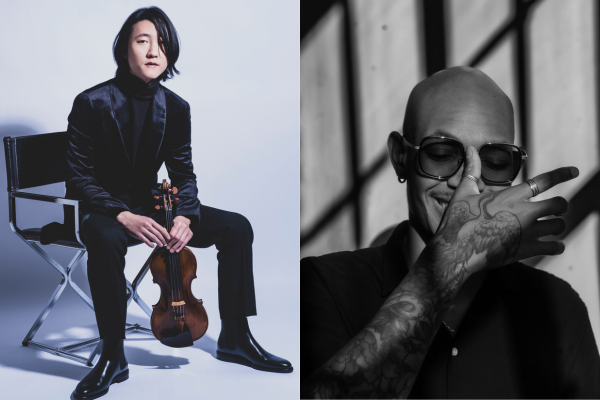 Asian man sitting with a violin in his hand, a bald light-skinned black man covering his mouth and wearing sunglasses